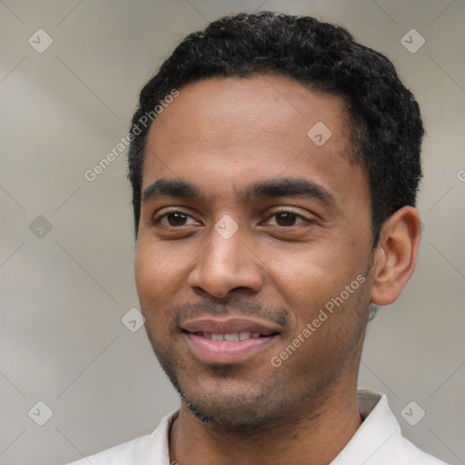 Joyful latino young-adult male with short  black hair and brown eyes