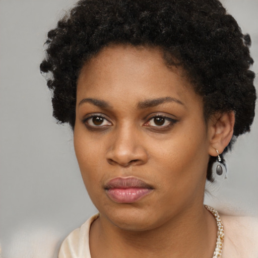 Neutral black young-adult female with short  brown hair and brown eyes