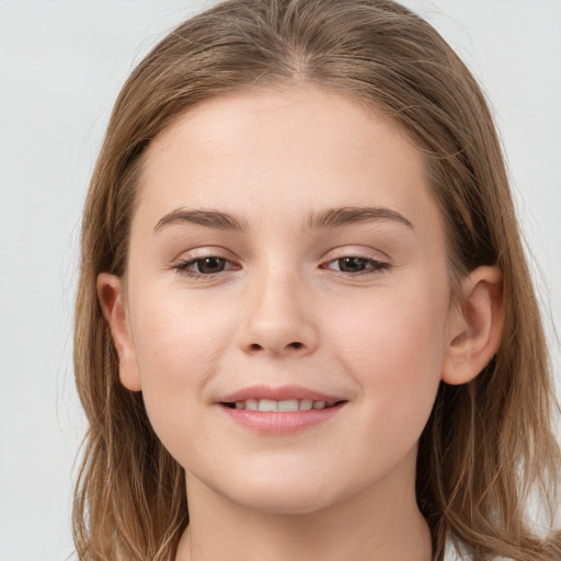 Joyful white child female with long  brown hair and grey eyes