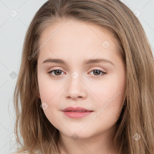 Joyful white child female with long  brown hair and brown eyes