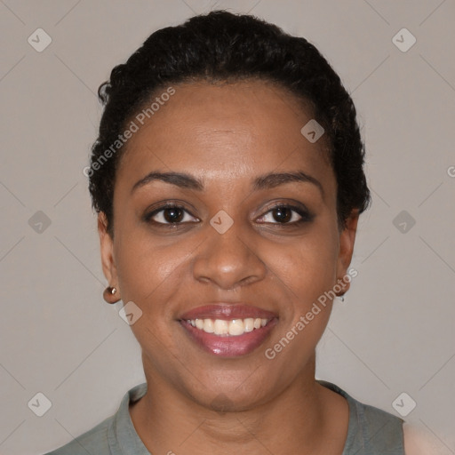 Joyful black young-adult female with short  brown hair and brown eyes