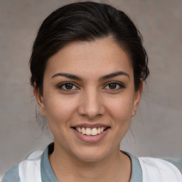 Joyful white young-adult female with medium  brown hair and brown eyes