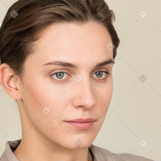 Neutral white young-adult female with short  brown hair and grey eyes