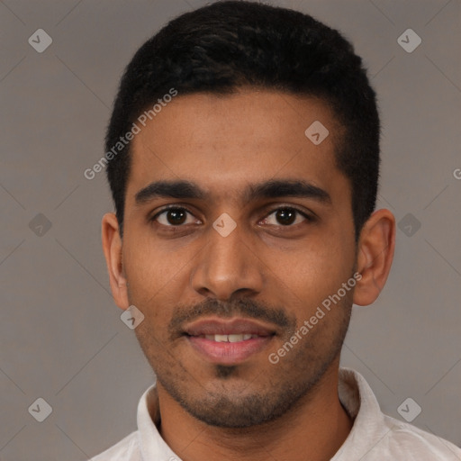 Joyful latino young-adult male with short  black hair and brown eyes