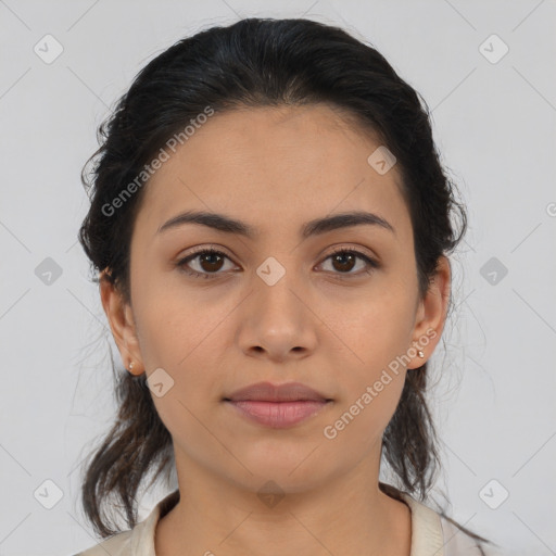 Joyful latino young-adult female with medium  brown hair and brown eyes