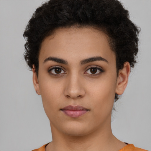 Neutral latino young-adult female with short  brown hair and brown eyes