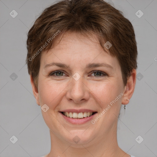 Joyful white young-adult female with short  brown hair and grey eyes