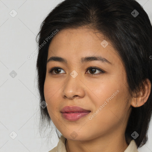 Joyful asian young-adult female with medium  brown hair and brown eyes