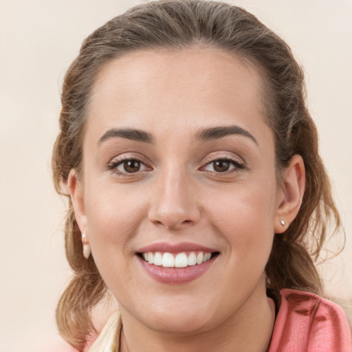 Joyful white young-adult female with medium  brown hair and grey eyes