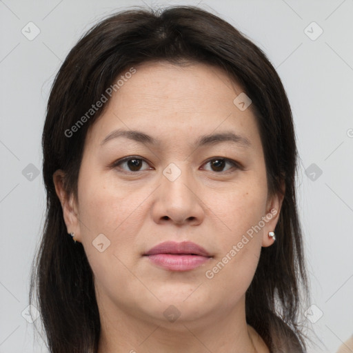 Joyful white adult female with medium  brown hair and brown eyes