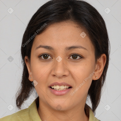 Joyful latino young-adult female with medium  brown hair and brown eyes