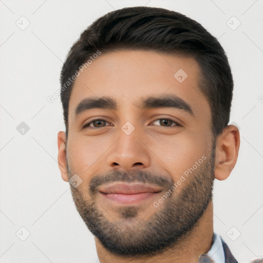 Joyful white young-adult male with short  black hair and brown eyes