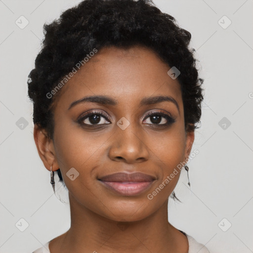 Joyful black young-adult female with short  black hair and brown eyes