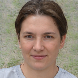 Joyful white young-adult female with short  brown hair and brown eyes