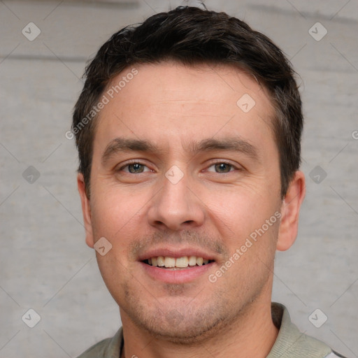 Joyful white young-adult male with short  brown hair and grey eyes