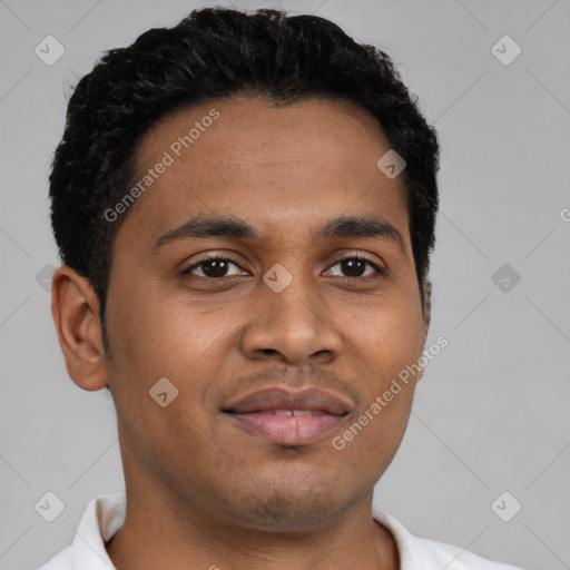 Joyful latino young-adult male with short  brown hair and brown eyes