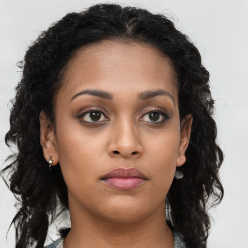 Neutral black young-adult female with long  brown hair and brown eyes