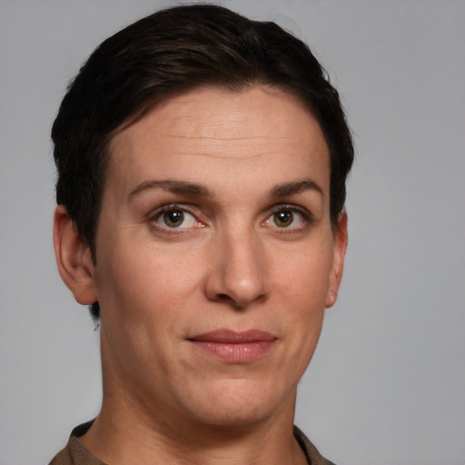 Joyful white adult female with short  brown hair and grey eyes