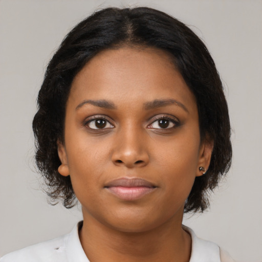 Neutral black young-adult female with medium  brown hair and brown eyes