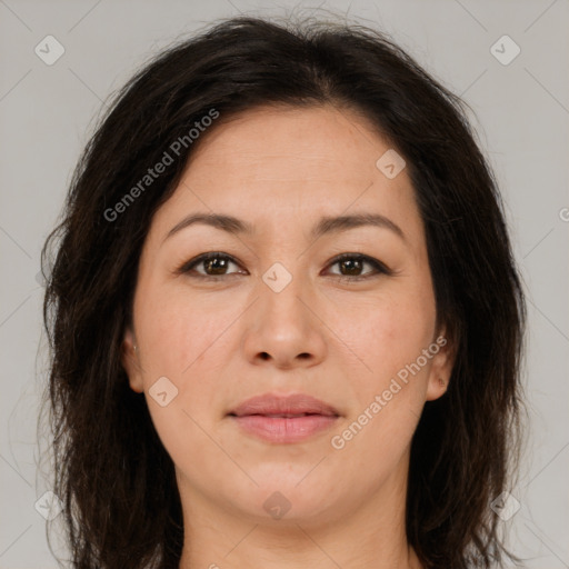 Joyful white adult female with long  brown hair and brown eyes