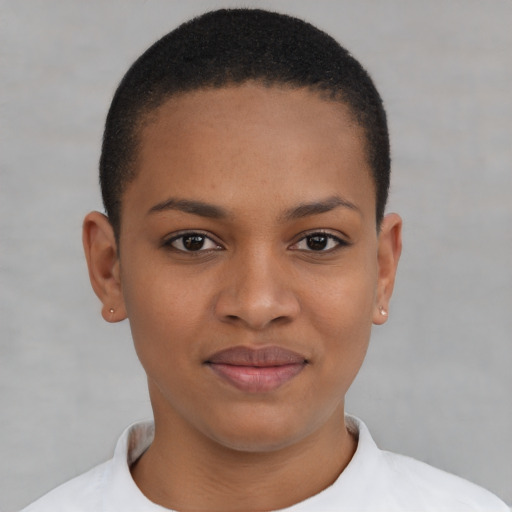 Joyful black young-adult female with short  brown hair and brown eyes