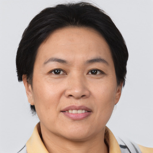 Joyful asian adult female with short  brown hair and brown eyes