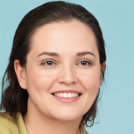 Joyful white young-adult female with medium  brown hair and brown eyes