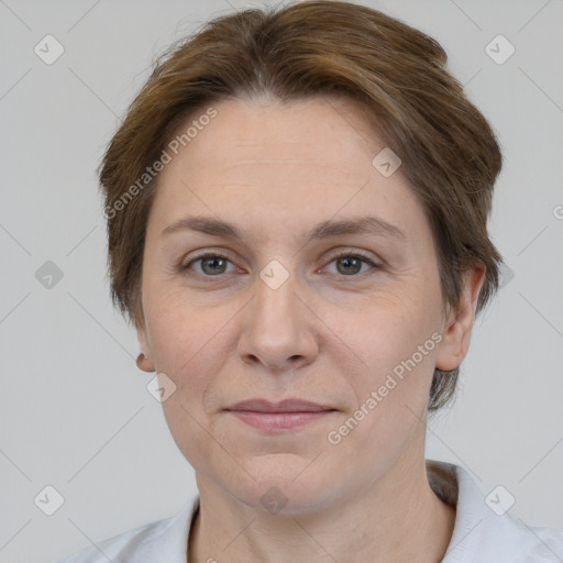 Joyful white adult female with short  brown hair and brown eyes