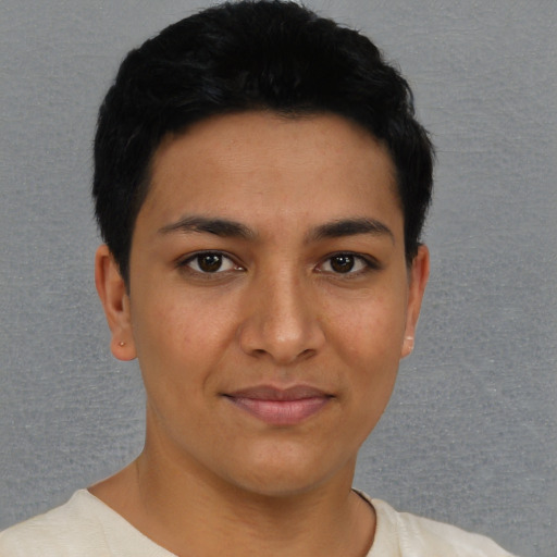 Joyful latino young-adult female with short  black hair and brown eyes