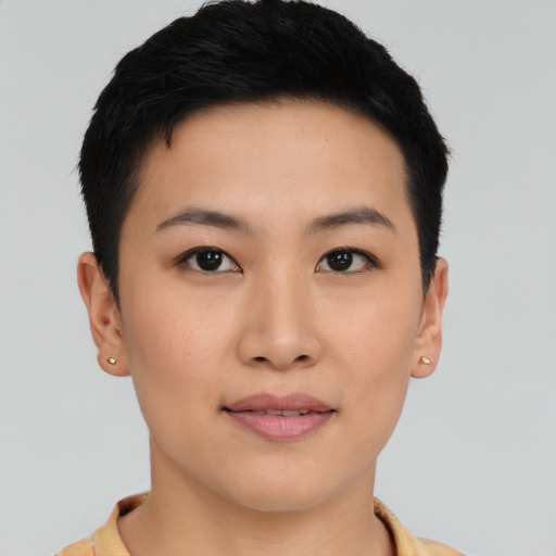 Joyful asian young-adult female with short  black hair and brown eyes