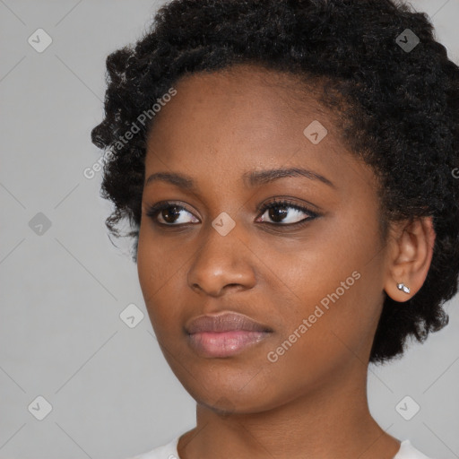 Neutral black young-adult female with short  black hair and brown eyes