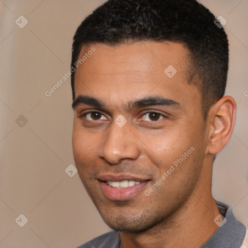 Joyful white young-adult male with short  black hair and brown eyes