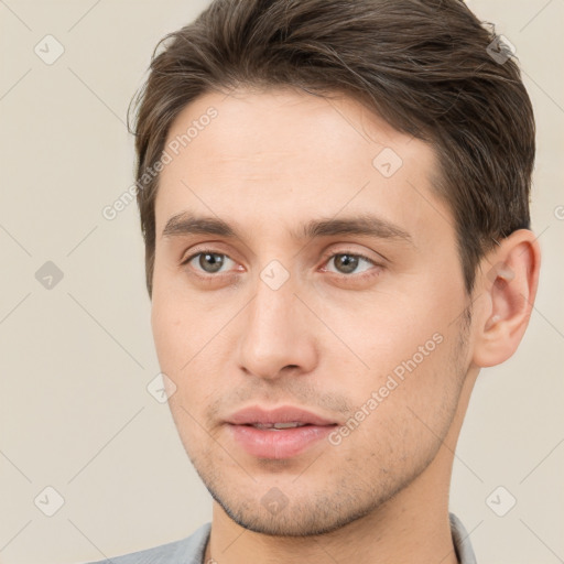 Neutral white young-adult male with short  brown hair and brown eyes