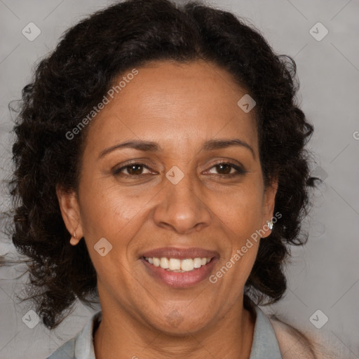 Joyful black adult female with medium  brown hair and brown eyes