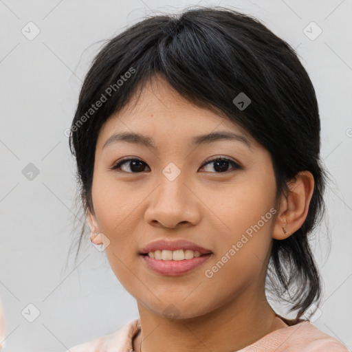 Joyful asian young-adult female with medium  black hair and brown eyes