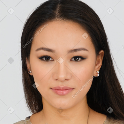 Joyful latino young-adult female with long  brown hair and brown eyes