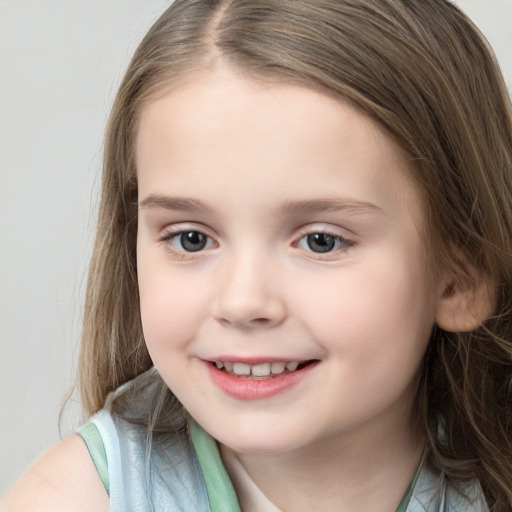 Joyful white child female with long  brown hair and brown eyes