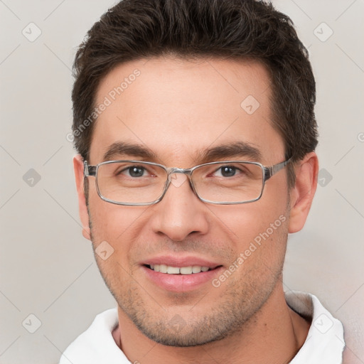 Joyful white young-adult male with short  brown hair and brown eyes