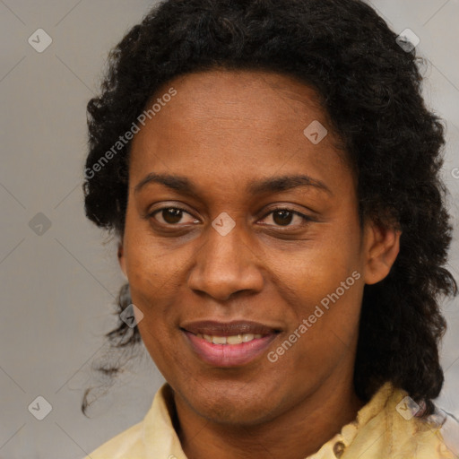 Joyful black adult female with short  brown hair and brown eyes