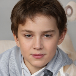 Joyful white child male with short  brown hair and brown eyes