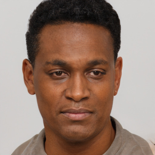 Neutral black young-adult male with short  black hair and brown eyes