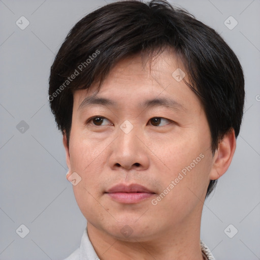 Neutral asian adult male with short  brown hair and brown eyes