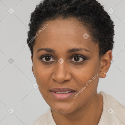 Joyful black young-adult female with short  black hair and brown eyes