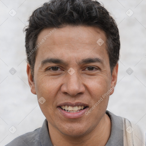 Joyful white adult male with short  black hair and brown eyes