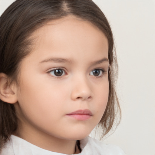 Neutral white child female with medium  brown hair and brown eyes