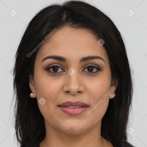 Joyful latino young-adult female with long  brown hair and brown eyes