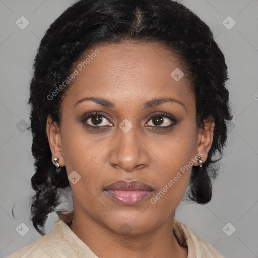 Joyful black adult female with medium  brown hair and brown eyes