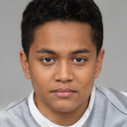 Joyful latino young-adult male with short  brown hair and brown eyes