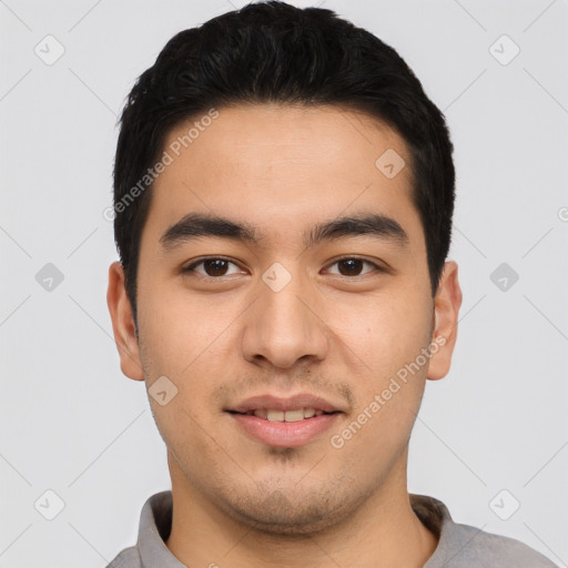 Joyful asian young-adult male with short  black hair and brown eyes