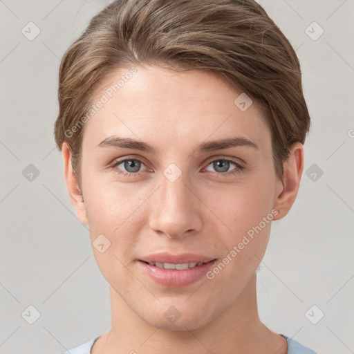 Joyful white young-adult female with short  brown hair and grey eyes